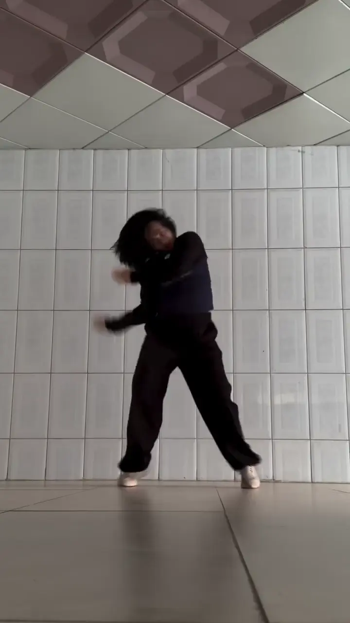 Firestarter Cover Against a White Tiled Wall